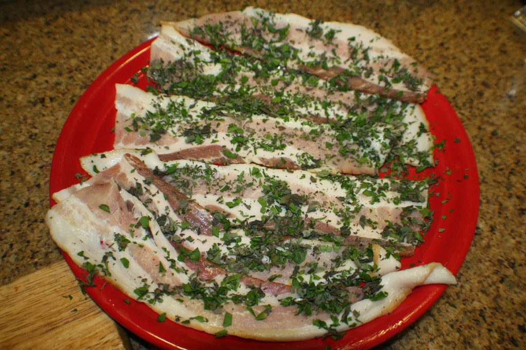 Bacon sprinkled with herbs 