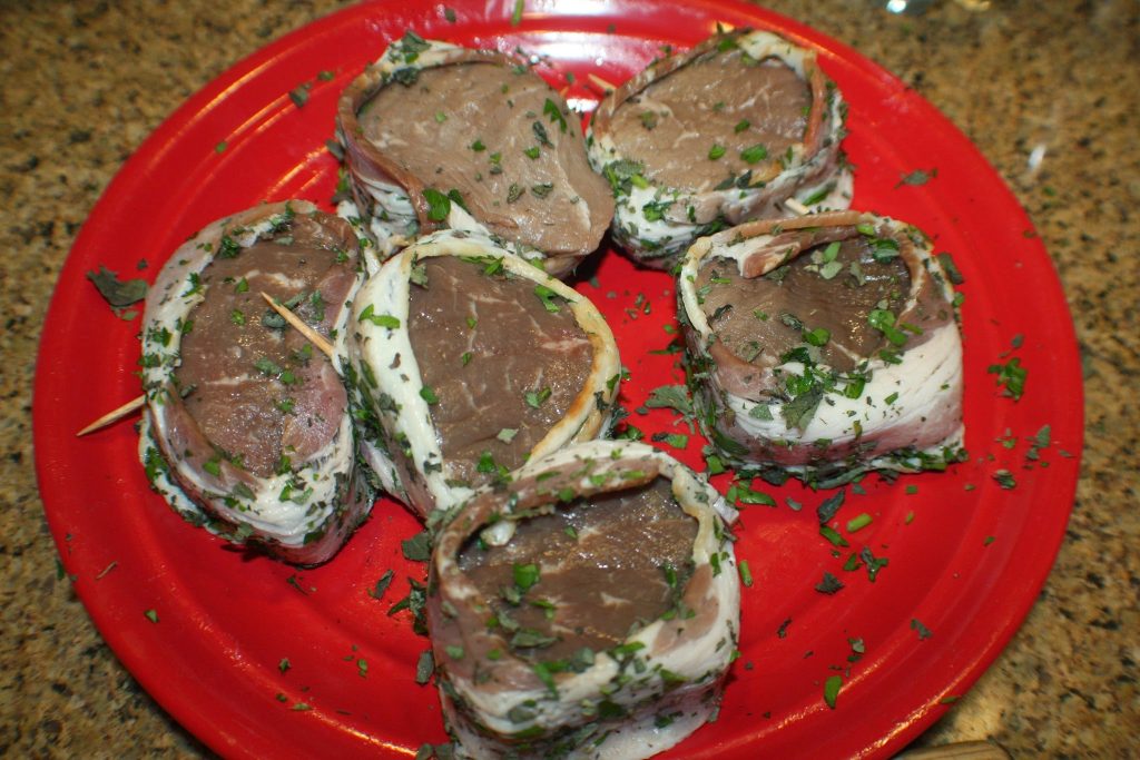 Wrapped steaks with bacon secured with toothpick 