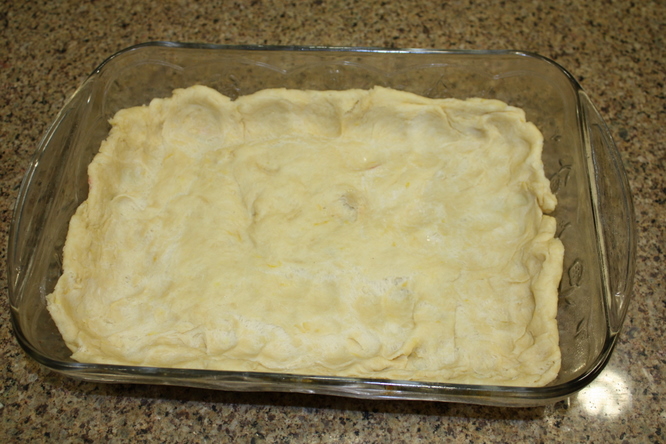 Press the dough into the baking dish. 