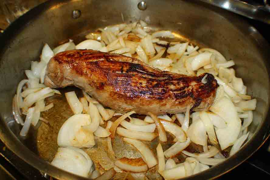 Pork sauerbraten with onions