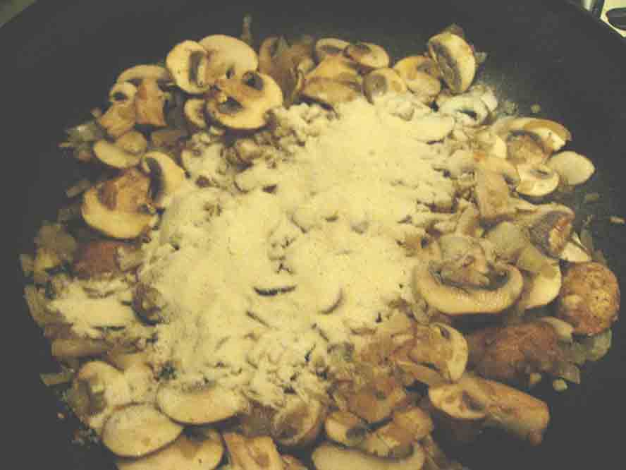 Add Flour to the mushrooms to the pan