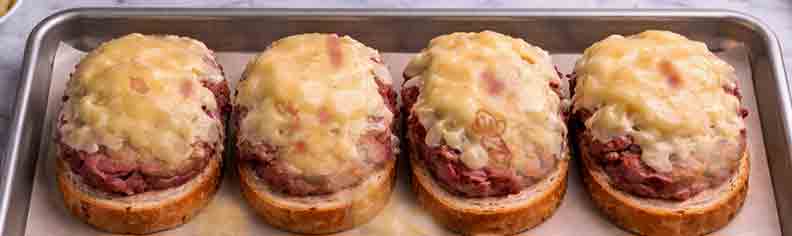 baked-reuben-slices Grill all the bread and lay 4 slices on a sheet pan., and layer ingredients.
