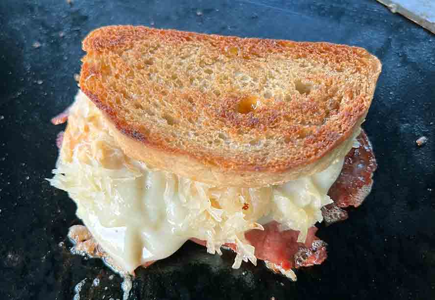 reuben-method2 Lift the sandwich back onto the pan
and brown the other side of the sandwich to a nice goldern brown.