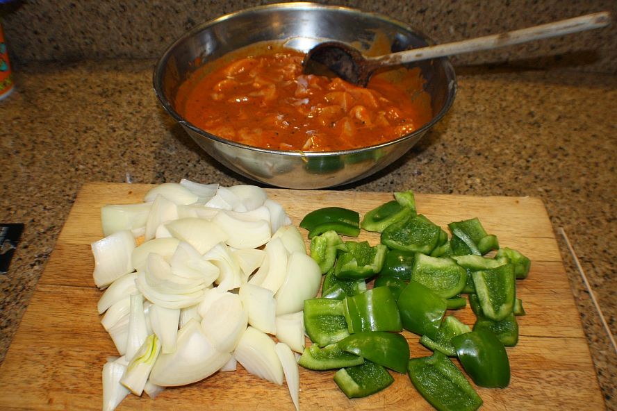 chicken-schaschlik-prep-vegetables.jpg chopped onions and green peppers with marinated chicken for schaschlik