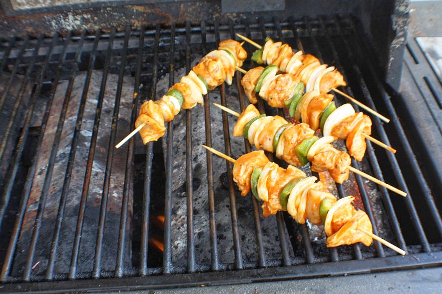 chicken-schaschlik-on-grill.jpg chicken schaschlik skewers cooking on a grill over direct heat