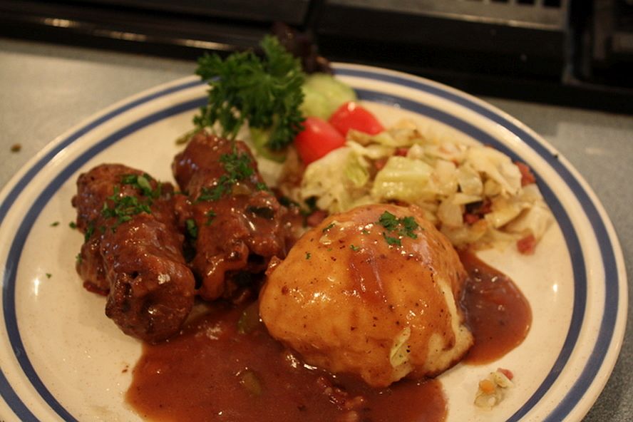 German rouladen beef rolls served with gravy and dumpling