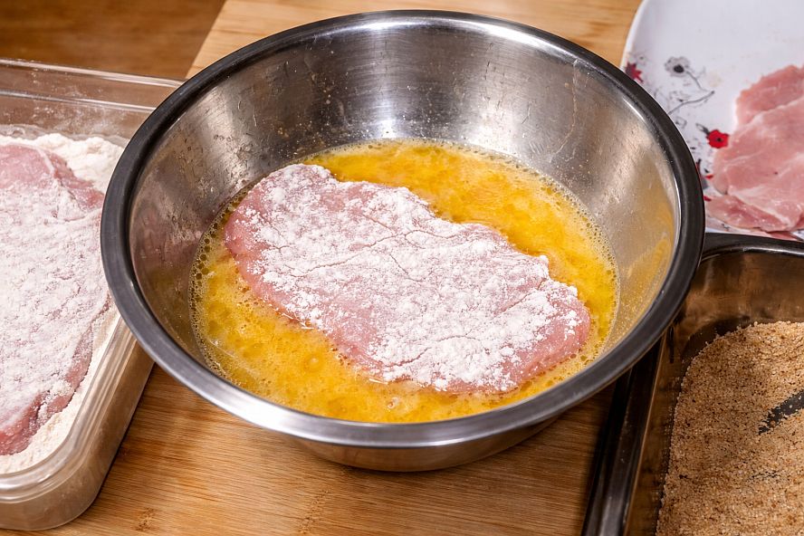 schnitzel-in-eggwash Dip the floured Schnitzel and put it in the egg wash