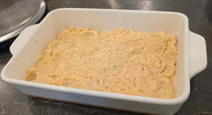 datschi-dough-in-pan Smoothe dough out in a 9x13 pan .