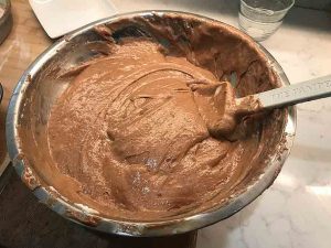 Chocolate cake batter gently folded with whipped egg whites until smooth and light.